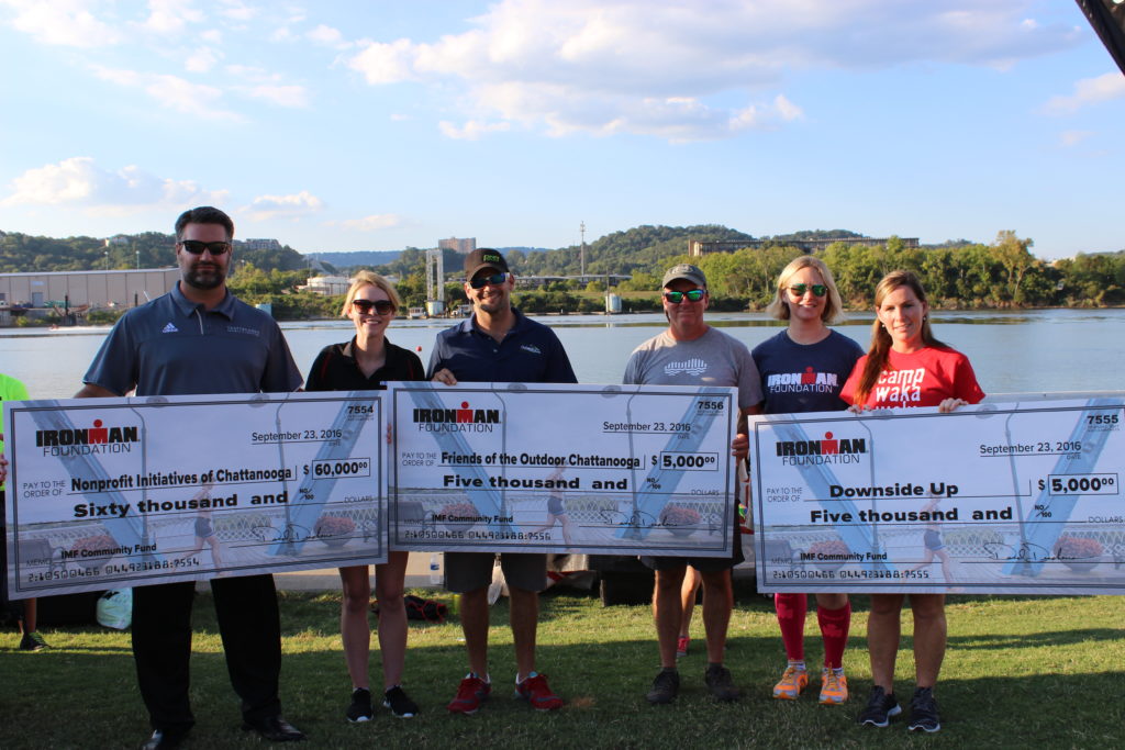 At the Athlete Welcome Ceremony, The IRONMAN Foundation presented checks to: Downside Up, Friends of The Outdoor Chattanooga, and various IRONMAN Chattanooga Volunteer Groups. TEAM IMF Athlete & IRONMAN Chattanooga Top Fundraiser, Erica Maynard-Uliasz, helped to present the grant awards!
