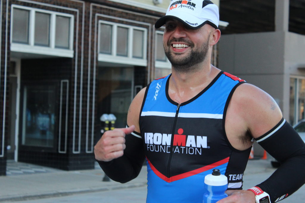 TEAM IMF Athlete, Jeremy McRae, flashes a smile as he passes by on the run course!