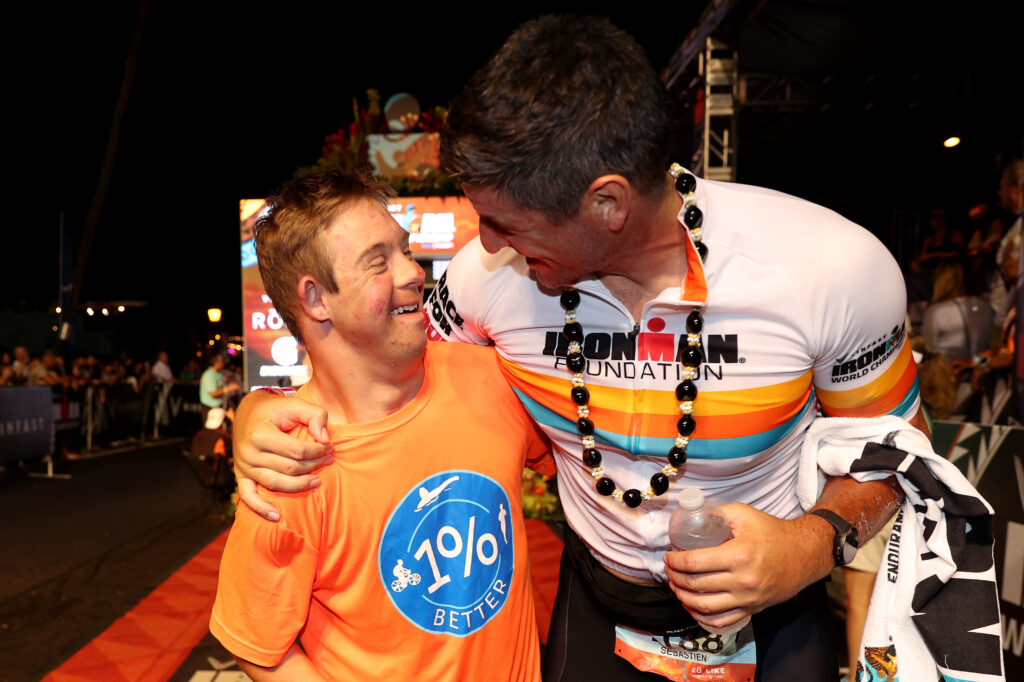 Brussels bombing victim, Sebastien Bellin, of Belgium celebrates with Chris Nikic after finishing the IRONMAN World Championship on October 8, 2022 in Kailua-Kona, HI. (Photo by Ezra Shaw/Getty Images for IRONMAN)