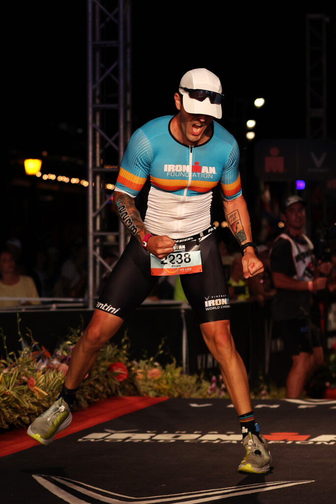 KAILUA KONA, HAWAII - OCTOBER 08: Ryan Kinder celebrates after finishing the IRONMAN World Championships on October 08, 2022 in Kailua Kona, Hawaii. (Photo by Tom Pennington/Getty Images for IRONMAN)