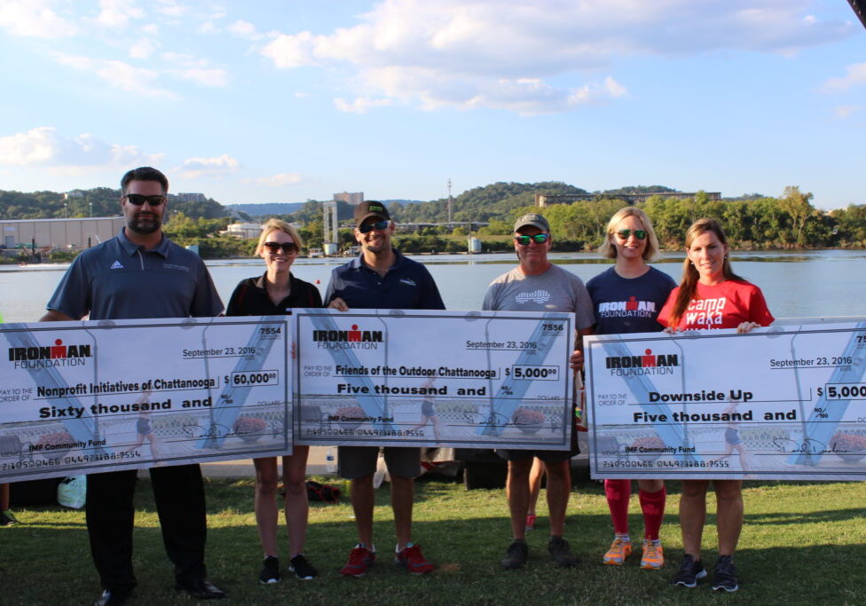 At the Athlete Welcome Ceremony, The IRONMAN Foundation presented checks to: Downside Up, Friends of The Outdoor Chattanooga, and various IRONMAN Chattanooga Volunteer Groups. TEAM IMF Athlete & IRONMAN Chattanooga Top Fundraiser, Erica Maynard-Uliasz, helped to present the grant awards!